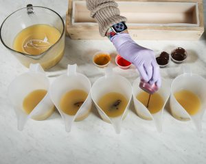 Soap in multiple containers, with colorant being added